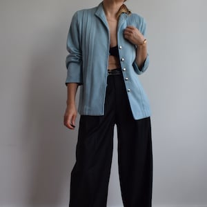 Vintage wool blazer in pastel blue. Originally women’s size M. 90’s era.
