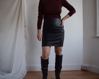 Vintage black leather mini skirt. Originally women’s size S. 90’s era.