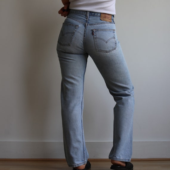 Vintage Levi’s mid rise 502 light wash jeans. Ori… - image 5