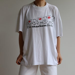 Camiseta vintage de algodão branco. Originalmente tamanho masculino XL. Era dos anos 80.