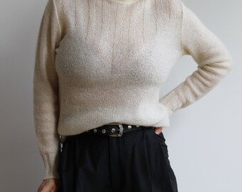 Vintage cream wool high neck jumper. Originally women’s size S. 90’s era.