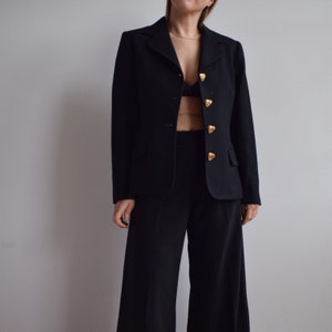 Vintage black wool blazer. Originally women’s size S. 90’s era.