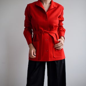 Vintage wool belted blazer in red. Originally women’s size S / M. Early 90’s era.
