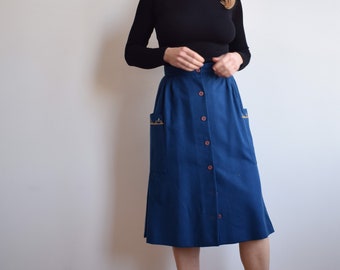 Vintage wool midi skirt in navy blue. Originally women’s size S / small M. Early 80’s era.