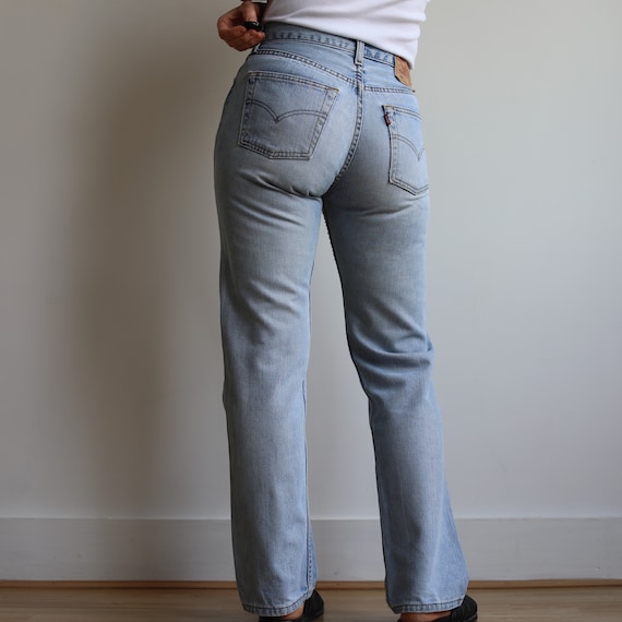 Vintage Levi’s mid rise 502 light wash jeans. Ori… - image 7