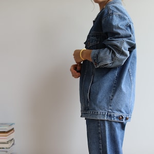 Vintage mid wash denim jacket. Originally men’s size S.