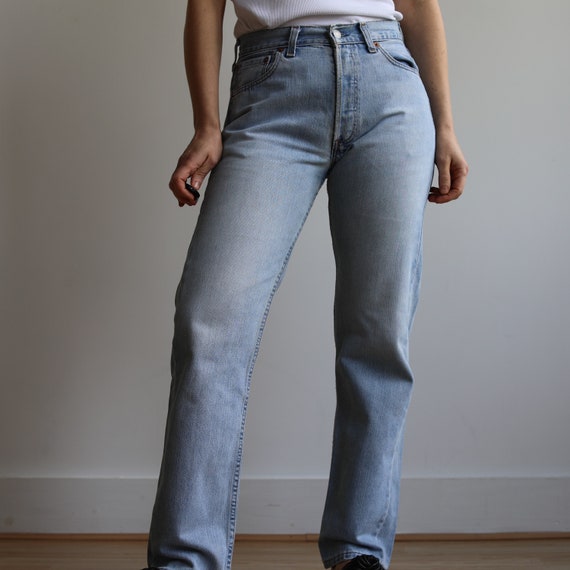 Vintage Levi’s mid rise 502 light wash jeans. Ori… - image 3
