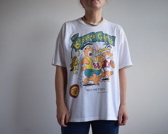 T-shirt vintage The Flinstones Bedrock Games. A l'origine taille homme XL. époque des années 80.