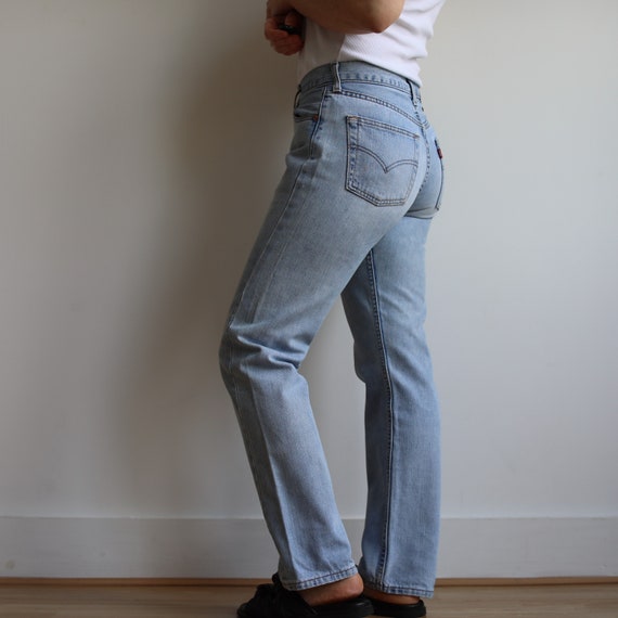 Vintage Levi’s mid rise 502 light wash jeans. Ori… - image 6