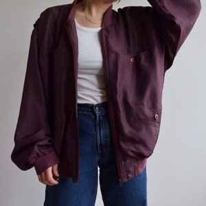 Vintage silk burgundy bomber jacket. Originally men’s size M / small L. 90’s era.