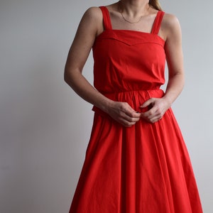 Vintage cotton dress in red. Originally women’s size S. 80’s era.