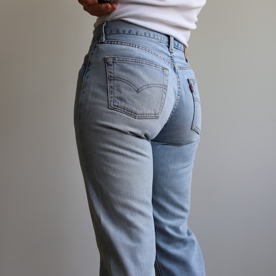 Vintage Levi’s mid rise 502 light wash jeans. Ori… - image 4