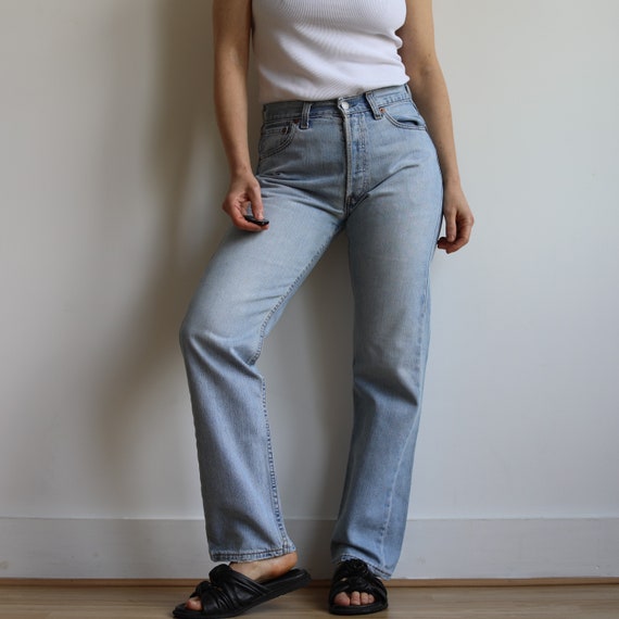 Vintage Levi’s mid rise 502 light wash jeans. Ori… - image 1