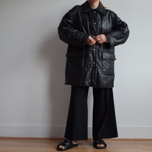 Vintage black leather coat. Originally women’s size M. 90’s era.