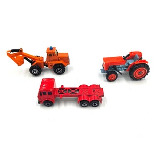 Lot of Vintage Toy Trucks and Tractors - Tomica, Zylmax, and Matchbox