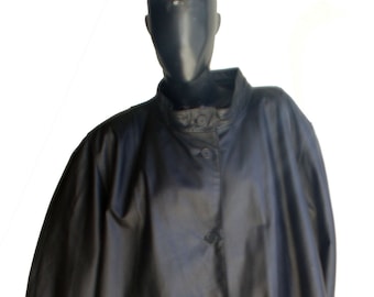 May include: A black leather coat with a stand-up collar and button closure. The coat has a long, flowing silhouette and is designed for a relaxed fit.