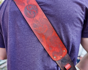Red Dragon & Phoenix hand crafted thick premium leather guitar strap.  Fully adjustable sizing to fit your perfect custom height  position.