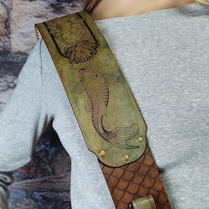 Handmade Leather Guitar Strap - Blue Lotus & Koi Fish. Hand crafted with thick premium leather. Fully adjustable sizing for custom height