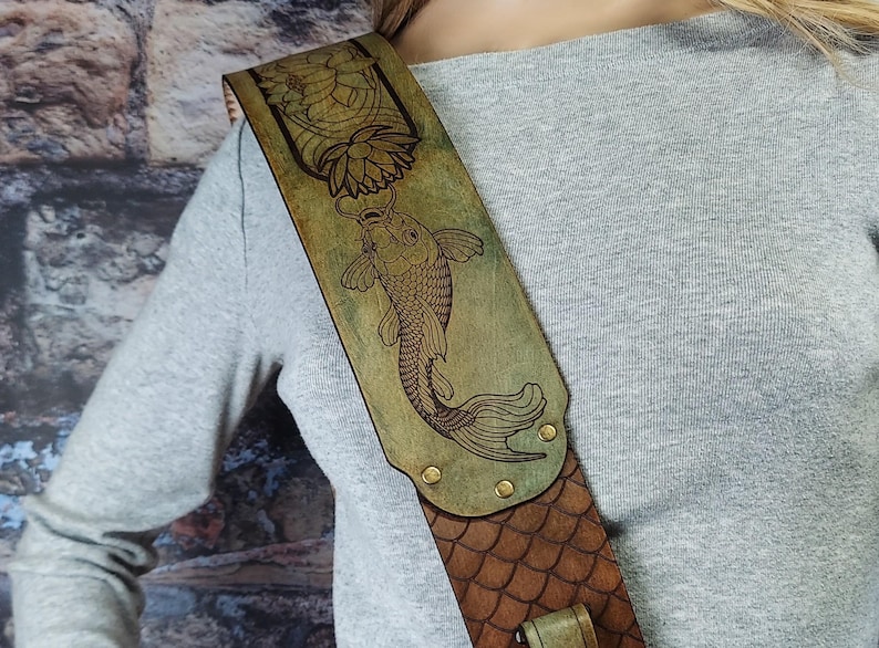 Handmade Leather Guitar Strap - Blue Lotus & Koi Fish. Hand crafted with thick premium leather. Fully adjustable sizing for custom height