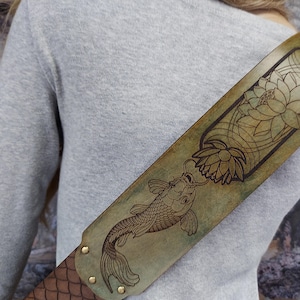 Handmade Leather Guitar Strap - Blue Lotus & Koi Fish. Hand crafted with thick premium leather. Fully adjustable sizing for custom height