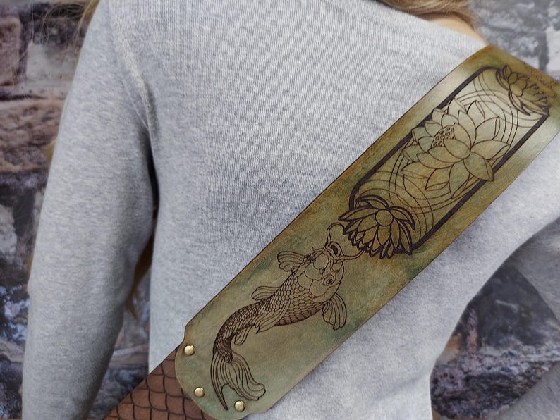 Handmade Leather Guitar Strap - Blue Lotus & Koi Fish. Hand crafted with thick premium leather. Fully adjustable sizing for custom height