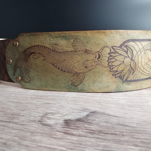 Handmade Leather Guitar Strap - Blue Lotus & Koi Fish. Hand crafted with thick premium leather. Fully adjustable sizing for custom height