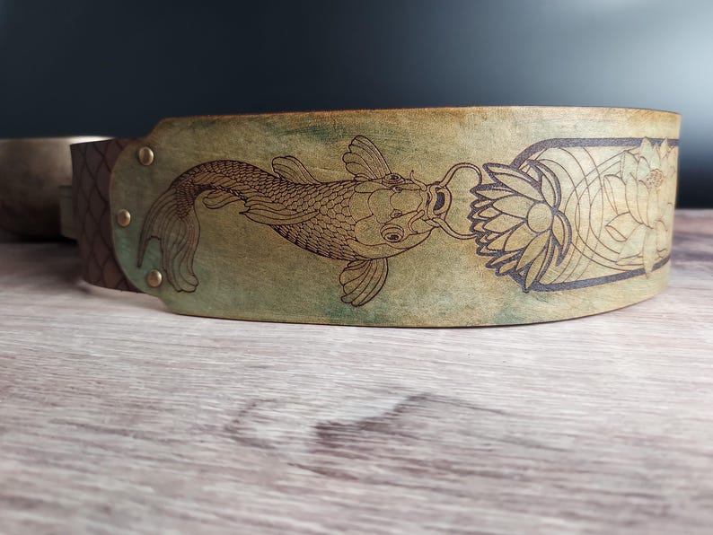 Handmade Leather Guitar Strap - Blue Lotus & Koi Fish. Hand crafted with thick premium leather. Fully adjustable sizing for custom height