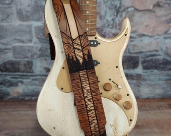 Mountain Lake Sunrise Leather Guitar Strap. Handmade full grain cowhide instrument strap. Golden sun over mountain, trees & river landscape