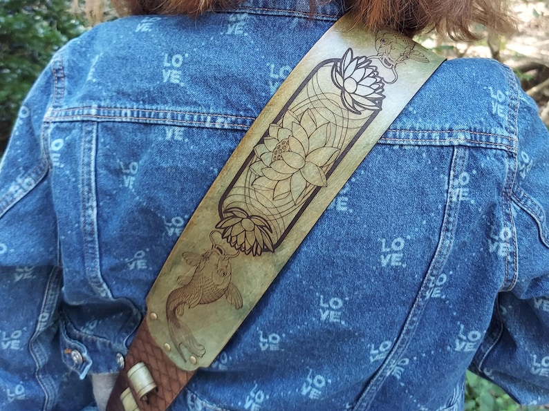 Handmade Leather Guitar Strap - Blue Lotus & Koi Fish. Hand crafted with thick premium leather. Fully adjustable sizing for custom height
