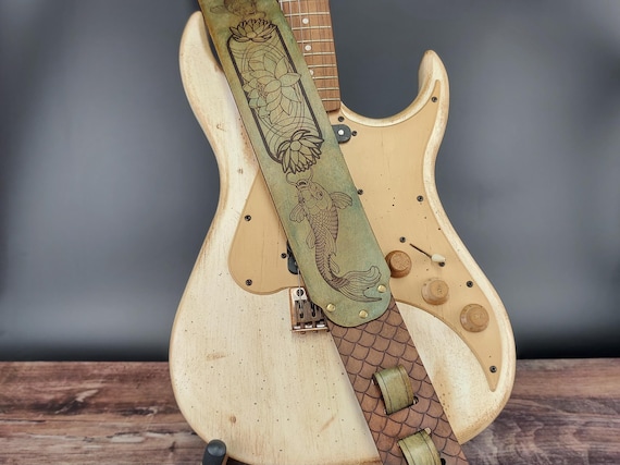 Handmade Leather Guitar Strap - Blue Lotus & Koi Fish. Hand crafted with thick premium leather. Fully adjustable sizing for custom height