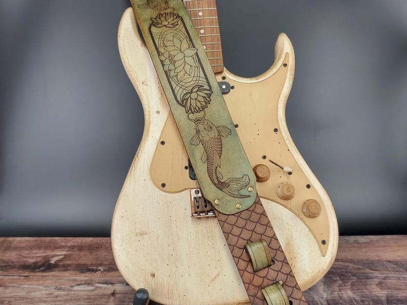 Handmade Leather Guitar Strap - Blue Lotus & Koi Fish. Hand crafted with thick premium leather. Fully adjustable sizing for custom height