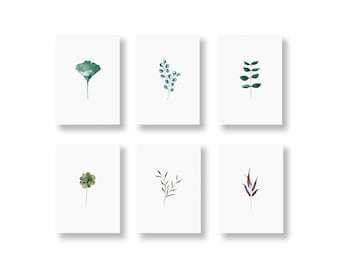Könnte beinhalten: Sechs Aquarell-Illustrationen von verschiedenen grünen Blättern und Zweigen auf weißem Hintergrund. Die Illustrationen sind einfach und elegant und eignen sich perfekt, um jedem Raum einen Hauch von Natur zu verleihen.