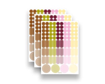 Peut inclure: Trois feuilles d'autocollants avec des formes variées et des couleurs douces. Les autocollants comprennent des cercles et des rectangles arrondis dans des tons de marron, vert, rose et jaune. Disposition en rangées et colonnes.