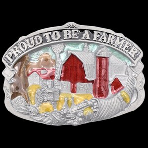 May include: Silver-toned belt buckle with a farm scene. The buckle features a red barn, silo, and tractor, with the words "PROUD TO BE A FARMER" arched across the top. The design includes a windmill and a field of oats.