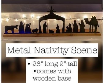 May include: A black metal nativity scene with a wooden base. The scene is 28 inches long and 9 inches tall, featuring silhouettes of the holy family, wise men, and animals. The text "Metal Nativity Scene" is displayed.