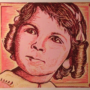 May include: A close-up portrait of a young girl with brown hair, wearing a light yellow shirt. The image is a woodblock print with a pink and yellow background.