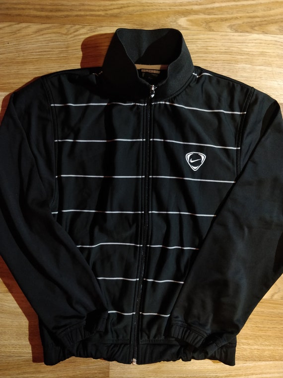 black nike jacket with white stripe