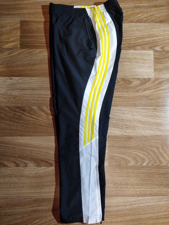 yellow and black adidas pants