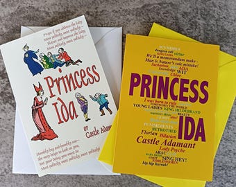 May include: Two greeting cards featuring Princess Ida. The white card displays a colorful illustration of characters and the text Princess Ida or Castle Adamant. The yellow card features a word cloud design with the text Princess Ida Castle Adamant.