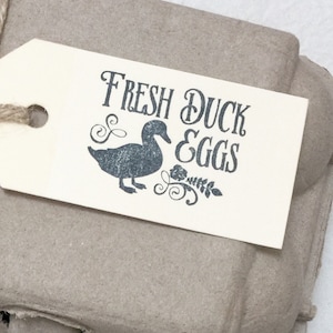 May include: A set of four brown paper gift tags with the text 
