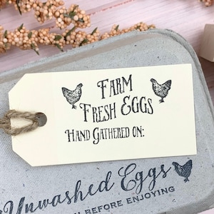 May include: A gray egg carton with a white tag that reads 