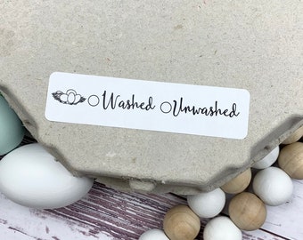 May include: A white label with a black illustration of a nest of eggs and the text "Washed Unwashed" with two circles next to the words.