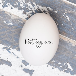 May include: A white egg with the text 