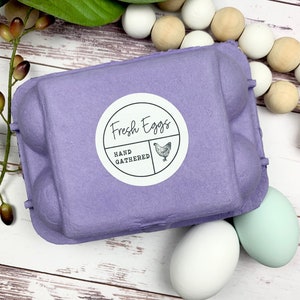 May include: A purple egg carton with a white sticker that says 