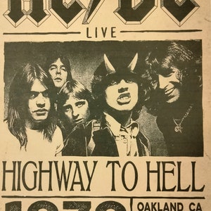May include: A black and white concert poster for AC/DC's 1979 Highway to Hell tour. The poster features a photo of the band members and the text "AC/DC LIVE HIGHWAY TO HELL 1979 TOUR OAKLAND CA WED 8:00 PM SEPT 05".