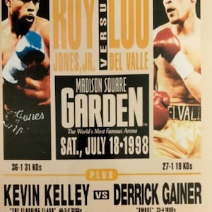 May include: A boxing poster advertising a fight between Roy Jones Jr. and Lou Del Valle for the Light Heavyweight Unification title. The fight took place at Madison Square Garden on July 18, 1998. The poster also advertises a fight between Kevin Kelley and Derrick Gainer.