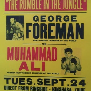 May include: A yellow and red poster advertising a boxing match between George Foreman and Muhammad Ali. The poster reads "The Heavyweight Championship of the World" and "The Rumble in the Jungle". The match took place on Tuesday, September 24th in Kinshasa, Zaire. The poster also says "See it "Live" on Big Circuit TV".