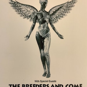May include: A black and white concert poster for Nirvana with special guests The Breeders and Come. The poster features a black and white image of an angel with wings. The concert is scheduled for Wednesday, December 1, 1993 at the Boutwell Auditorium. Tickets are $16.50 in advance or $17.50 on the day of the show.