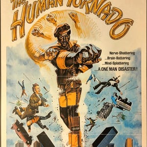 May include: Vintage movie poster for "The Human Tornado" starring Rudy Ray Moore. The poster features a stylized illustration of Moore as a superhero, with buildings and cars being destroyed. Text includes "Watch out mister... Here comes the twister!"
