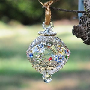 Egyptian Blown Glass Ornament –A clear designs with small colored  flower with golden accent
